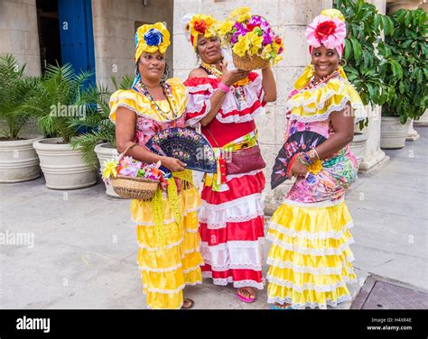 Cuban Women With Traditional Clothing In Old Havana Street Stock Photo