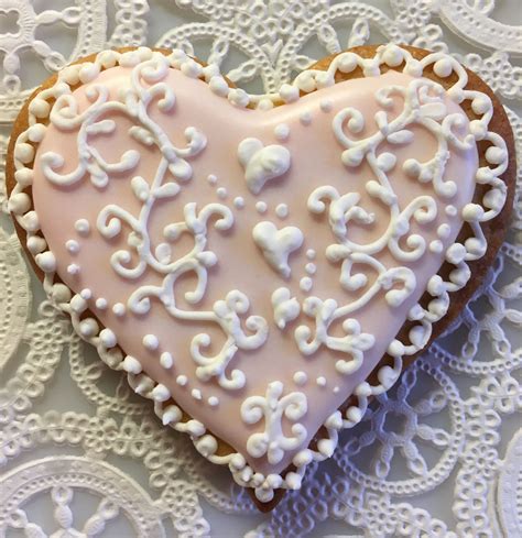 Royal Icing Valentines Day Cookie With Piped Filigree Hearts And Lace Border Iced Pink
