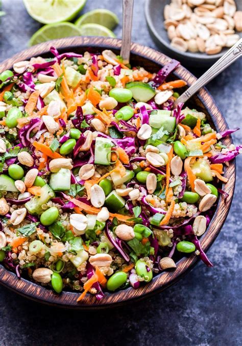 Thai Quinoa Salad In Wooden Bowl Topped With Peanuts In Edamame