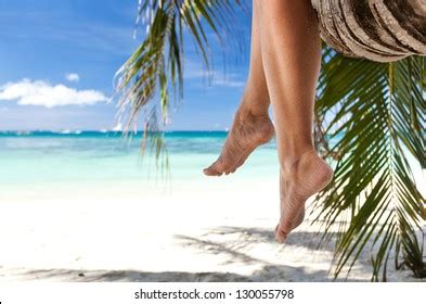 Woman Legs On Beach Relaxing On Stock Photo Edit Now