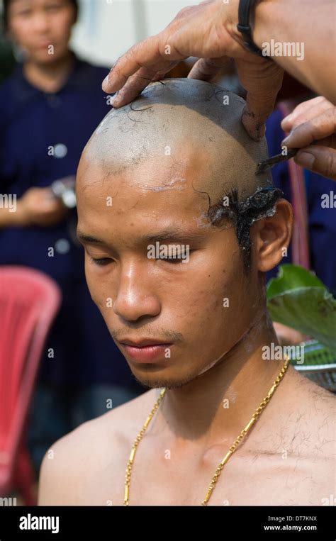 Initiate Having His Head Shaved Before Being Processed To Wat Hat Siao