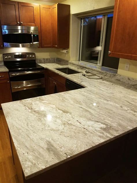 I have seen a lot of kitchens throughout the years from pals and family's houses. White Glacier granite counter tops with maple cognac ...