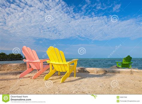 Summer Scene With Colorful Lounge Chairs On A Tropical