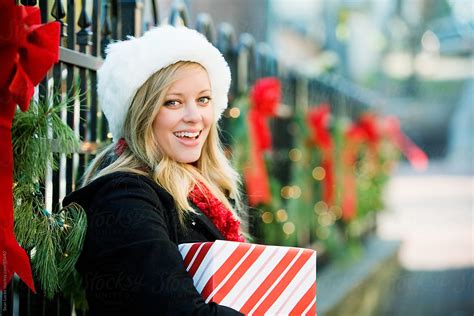 Christmas Christmas Girl Holding Holiday T By Stocksy Contributor