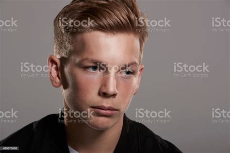 White Teenage Boy Looks Away Head And Shoulders Horizontal Stock Photo