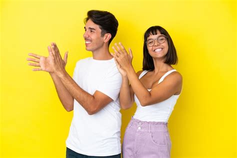 Premium Photo Young Mixed Race Couple Isolated On Yellow Background