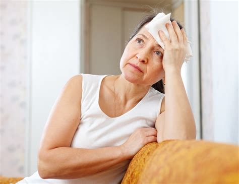 Free Photo Mature Woman Uses Handkerchief On Head