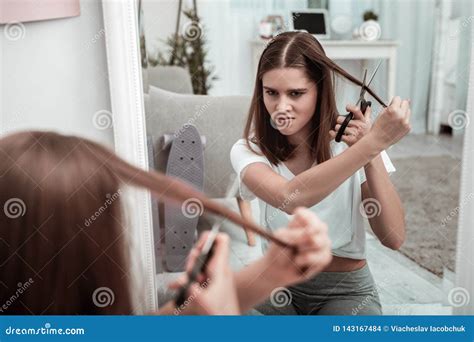 Woman Attempting To Cut Her Hair Herself Stock Photo Image Of Teen Body