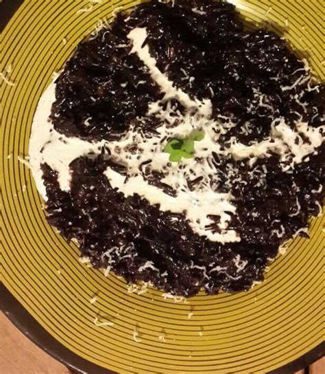 Fully coated and covered with sour cream and parmesan cheese. Forbidden rice risotto with chicken stock, parmesan and ...