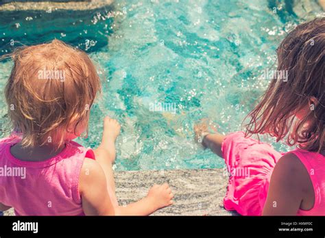 Cute Little Girl Sitting Poolside Hi Res Stock Photography And Images