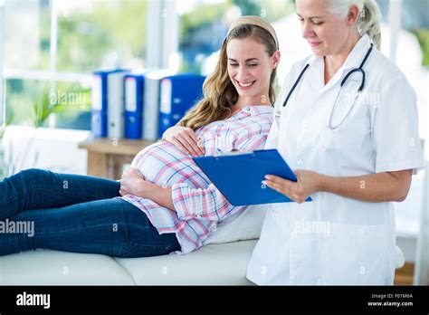 Female Doctor Talking To A Pregnant Woman Stock Photo Alamy