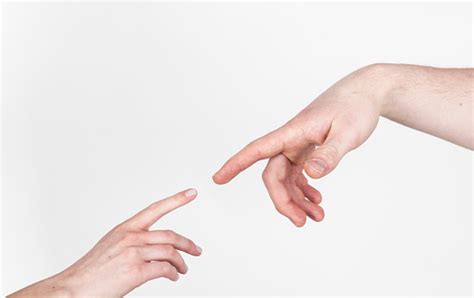 Fingers Of Two People Nearly Touching Stock Photo Download Image Now