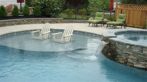 Custom Swimming Pool With Sun Shelf And Raised Spa Custom Swimming Pool Small Swimming Pools