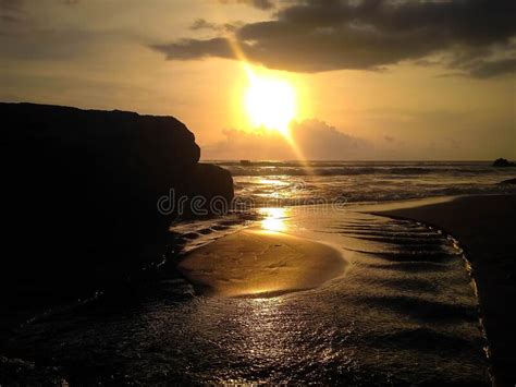 Sunset View With River Beach Flow And The Rocks At Batu Bolong Beach