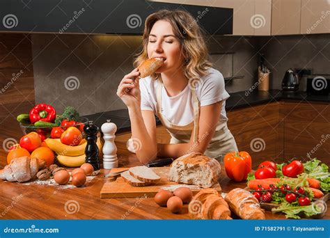 Pretty Young Housewife Biting Bread In Her Hands Stock Image Image Of Hunger Flavour 71582791