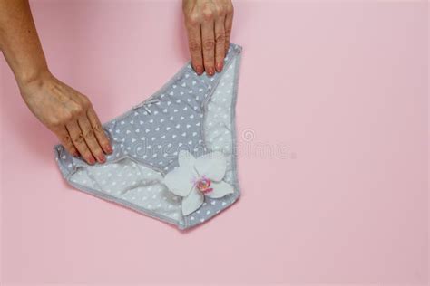 Womenand X27s Hands With Beautiful Panties On Lilac Background Stock