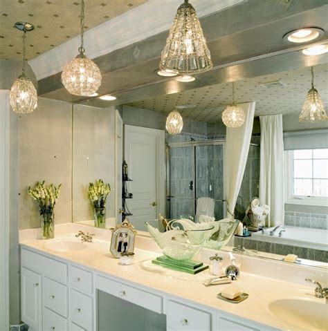 Streamlined tube lights enhance this sleek bath vanity while providing soft light. Unique Bathroom Vanity Design with Pendant Lighting ...