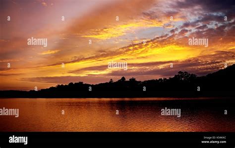 A Scenic Vibrant Cloudy Golden Sunrise Seascape Photographed From The