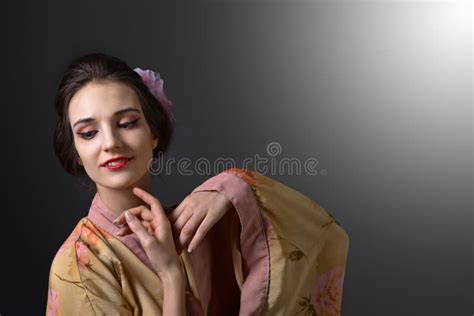 Young Beautiful Woman In Traditional Japanese Kimono Stock Photo
