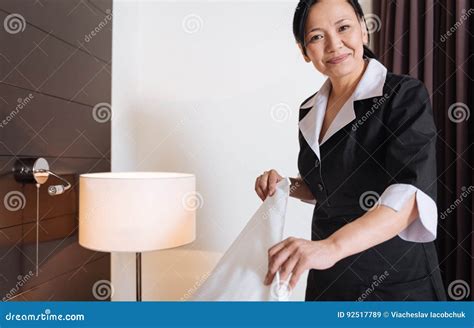 Happy Delighted Woman Working As A Hotel Maid Royalty Free Stock Photo