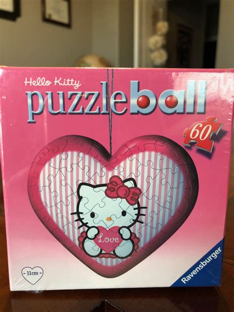 White leather string tied behind the neck. Hello Kitty puzzle ball hear shaped | Hello kitty, Kitty ...