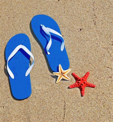 Premium Photo Blue Flip Flops And Starfish By The Sea