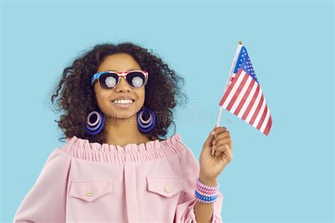 Cute African American Preteen Girl With National American Flag Smiling