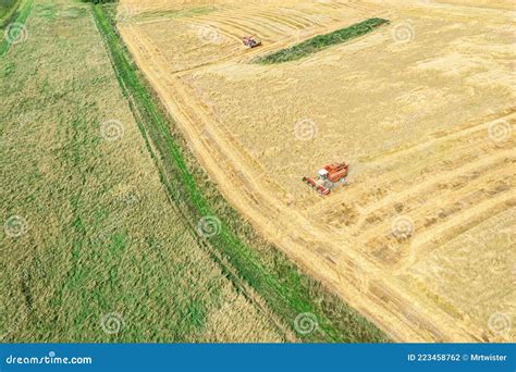 Combine Harvesters Working On The Large Wheat Field Panoramic Aerial