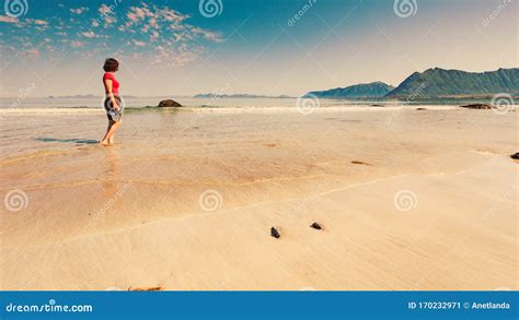Woman Walking On Sandy Beach Lofoten Norway Stock Image Image Of