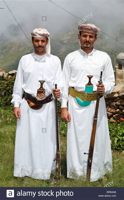 How much do you want to spend on your suit and what will it be used for? Two men wearing traditional Yemeni dress in Al Hajjarah ...