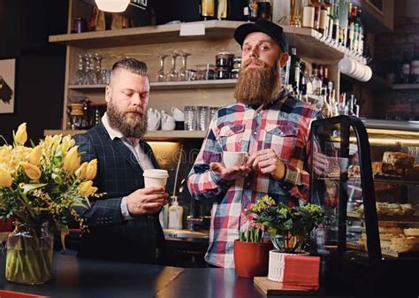 Two Bearded Hipster Coffee Shop Owners At The Counter Stock Image