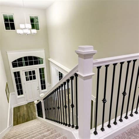 Hand rails and newels are unprimed poplar. Chicago Stairs and Rails | Iron Wrought Railings