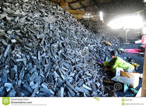 Charcoal factory in kuala sepetang, perak malaysia. Worker in charcoal factory editorial photo. Image of ...
