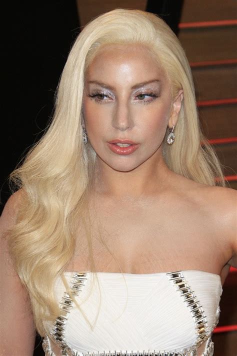 Lady Gaga Wavy Platinum Blonde Faux Sidecut Side Part Hairstyle