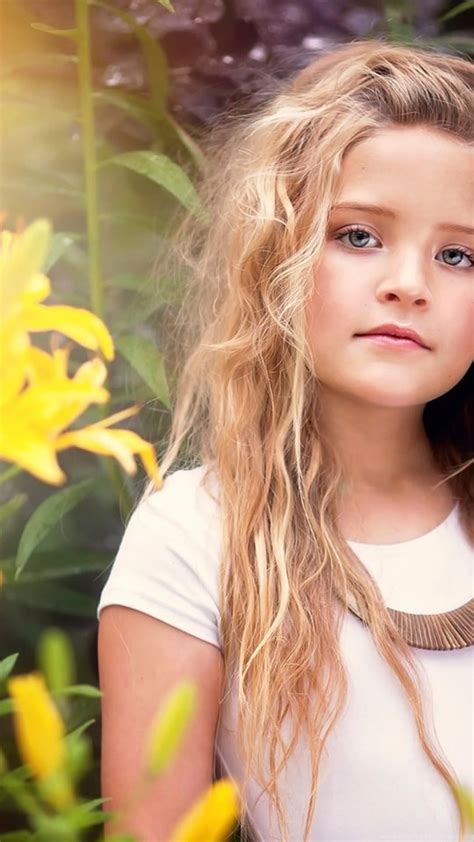 Download Cute Little Girl Portrait Yellow Flowers Wallpapercute