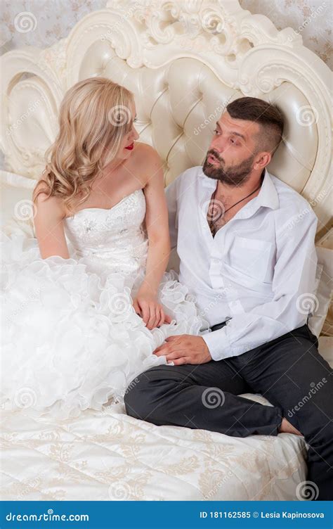 Beautiful Young Couple Resting In Bed The Bride And Groom In Bed A