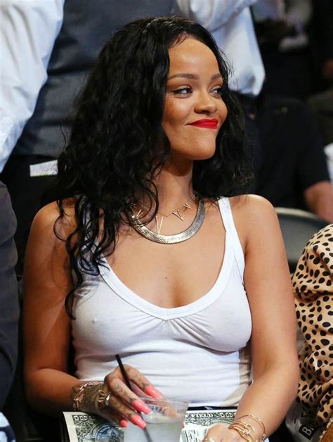 Rihanna Flaunts Boobs As She Goes Braless In See Through White Vest For Basketball Game In New