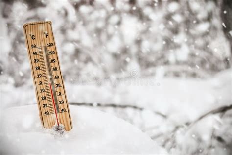 Thermometer With Subzero Temperature Stuck In The Snow Stock Image