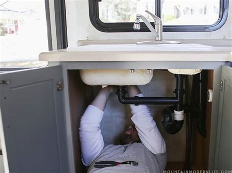 While our rv kitchen sink was in decent condition, we figured a single basin sink would be more functional and lucked out by finding a new one on ebay for $20, which you can see installed in our tiny kitchen reveal. How to Remove Your RV Kitchen Sink | MountainModernLife.com