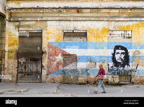 Wall Mural With Cuban Flag And Che Guevara With Passersby Hi Res Stock