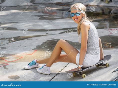 Young Girl Sitting On Skateboard In Skatepark Stock Image Image Of
