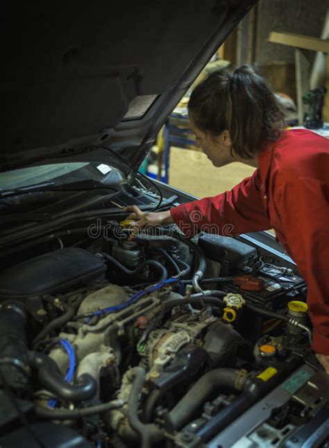 Female Mechanic Inspecting Car Engine Stock Image Image Of Workshop