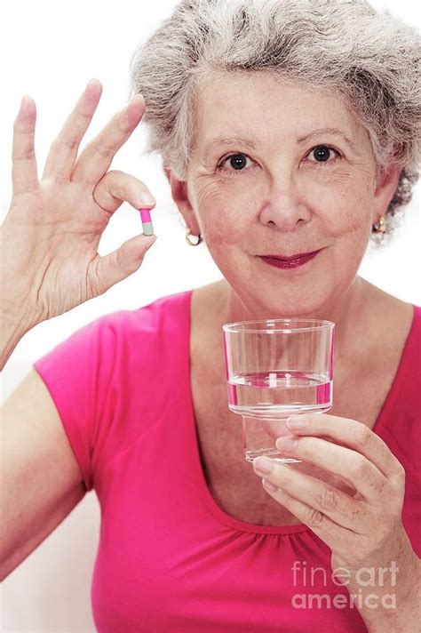 Elderly Woman Taking A Drug Capsule Photograph By Lea Paterson Science Photo Library Fine Art