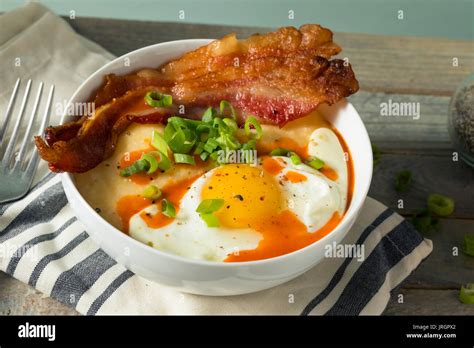 Homemade Cheesy Breakfast Grits With Eggs And Bacon Stock Photo Alamy