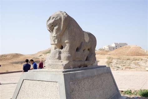 3 Men Next To The Black Basalt Statue Of The Lion Of Babylon Which