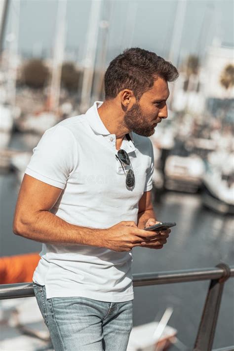 Cool And Attractive Slovenian Man With Sunglasses In The Port Stock