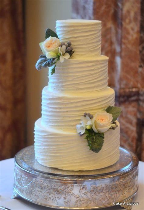 · posted on nov 7, 2015. Simple 2-tier cake with rippled white icing and 2 ...