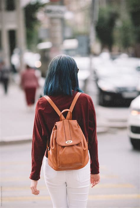 Young Woman Walking On The Street Del Colaborador De Stocksy Alexey