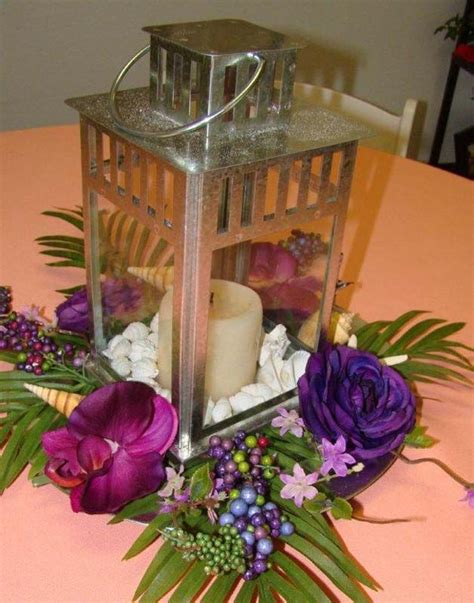 Lantern Ceterpices With Purple Centerpieces Sand Petal Weddings