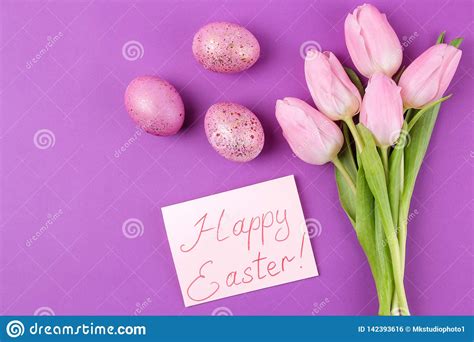 Easter Pink Easter Eggs And Flowers Tulips On A Trendy Purple